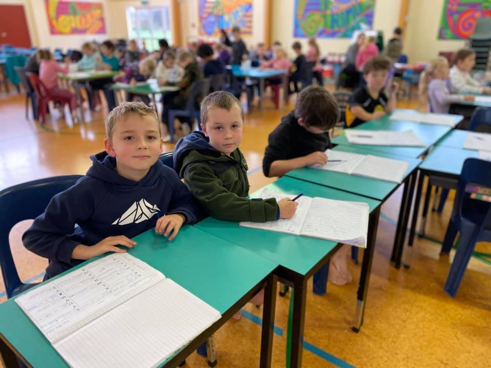 Photo of two boys working at desks